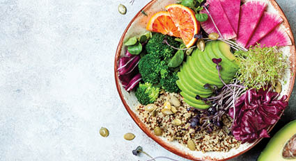 Vegan, detox Buddha bowl with quinoa, micro greens, avocado, blood orange, broccoli, watermelon radish, alfalfa seed sprouts  Top view, flat lay, copy space 
