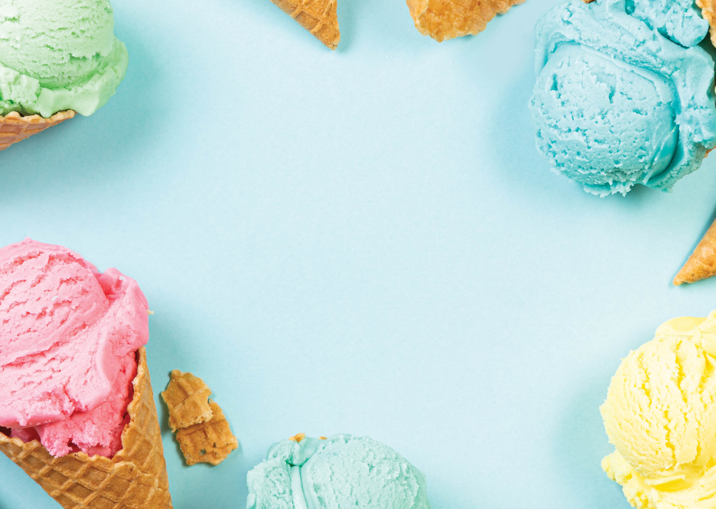 Pastel ice cream in waffle cones, bright background, copy space
