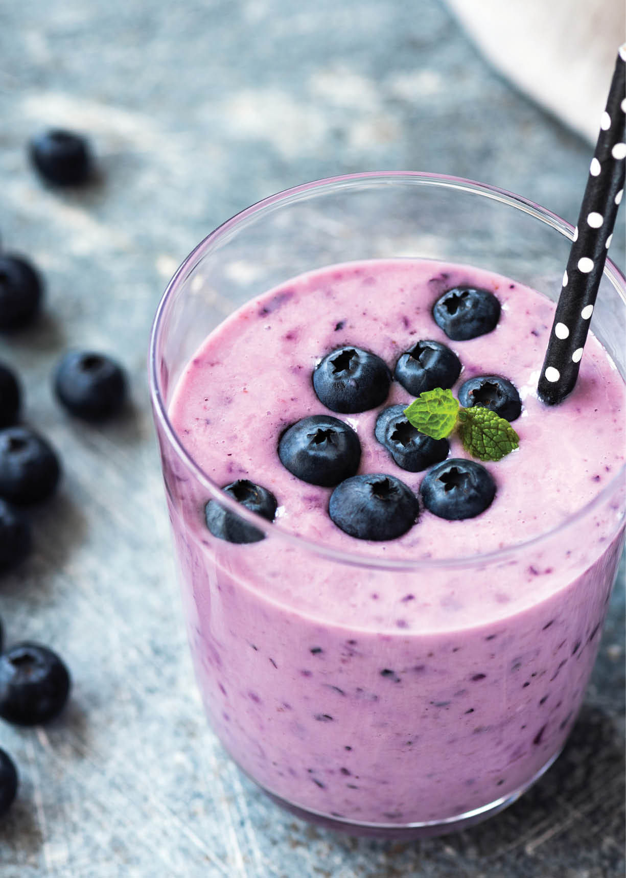 Tasty blueberry smoothie in glass  Healthy refreshing drink, vegan and vegetarian diet food concept