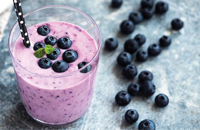 Tasty blueberry smoothie in glass  Healthy refreshing drink, vegan and vegetarian diet food concept