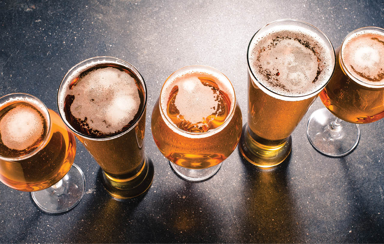 Beer glasses on dark table