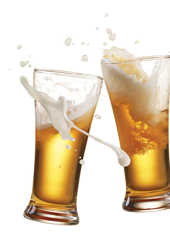 two glasses of beer toasting creating splash