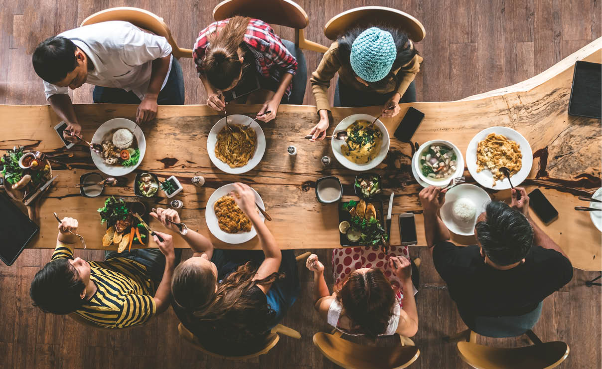Group of happy friends having nice food and drinks, enjoying the party and communication, Top view of Family gathering together at home for eating dinner.